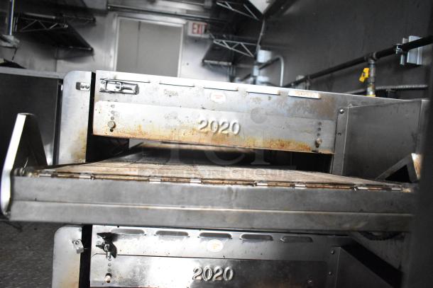 2021 Diamond Cargo 8.5' x 24' Cold Food & Beverage Fulfillment Trailer interior; metal racks; moderate wear.