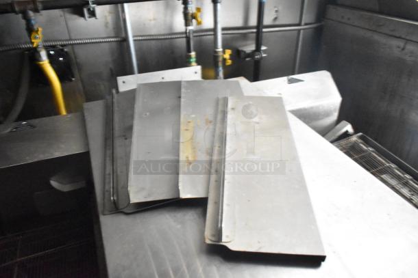 Interior view of a 2021 Diamond Cargo 8.5' x 24' trailer showing metal panels and pipes. Suitable for cold food and beverage fulfillment.