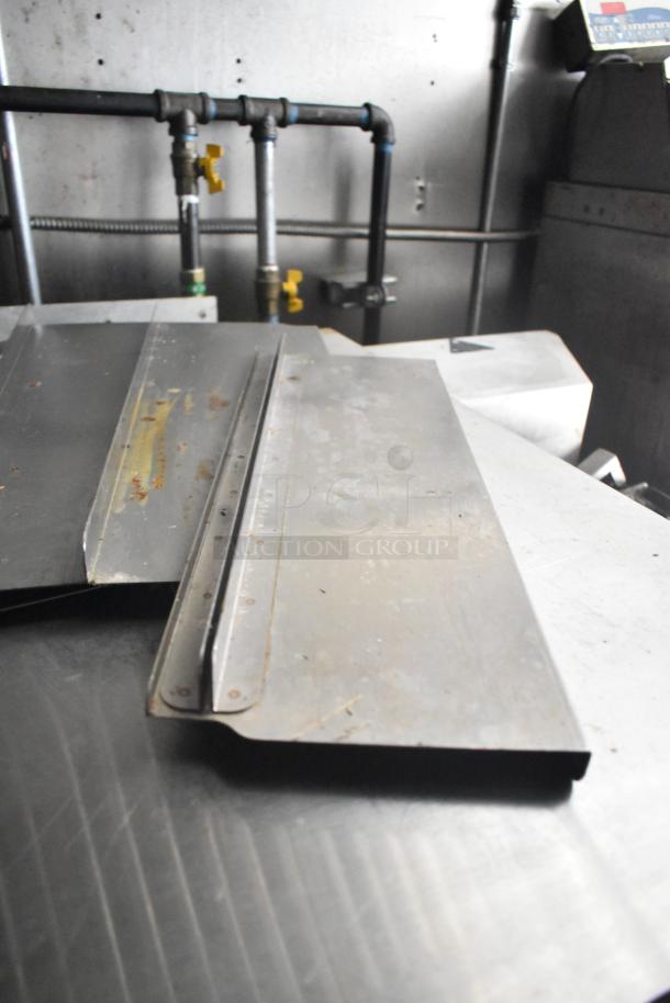 2021 Diamond Cargo 8.5' x 24' trailer interior view, featuring metal surfaces and plumbing, indicating cold storage use.