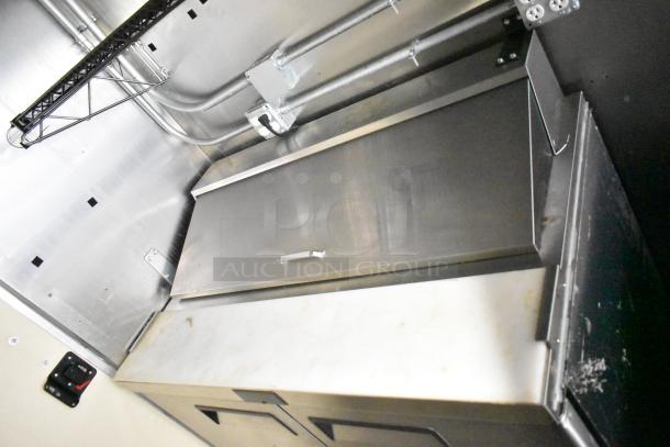 2021 Diamond Cargo 8.5' x 24' food trailer interior, stainless steel surfaces, electrical wiring visible, condition good.