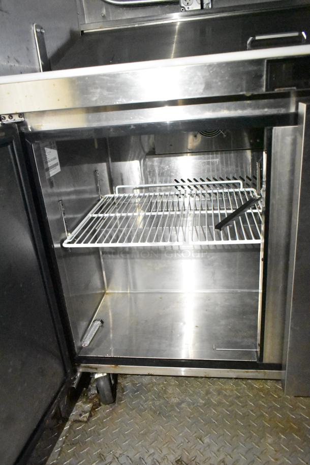 2021 Diamond Cargo 8.5' x 24' trailer interior, showcasing stainless steel shelving and refrigeration setup. Ideal for food service.