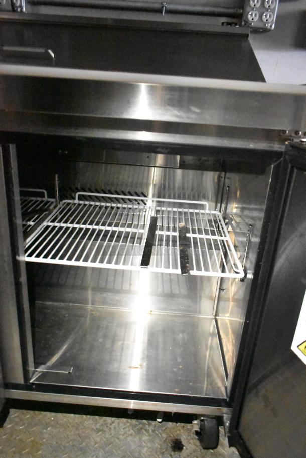 2021 Diamond Cargo 8.5' x 24' trailer interior, showcasing stainless steel shelving, ideal for cold food and beverage storage.