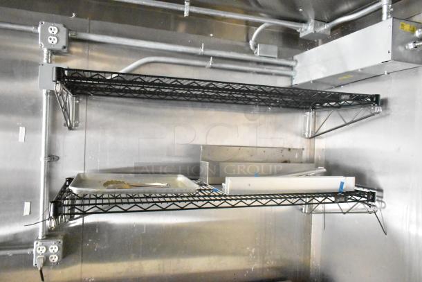 2021 Diamond Cargo 8.5' x 24' trailer interior with metal shelving, tongs on tray, electrical outlets, and wiring visible.