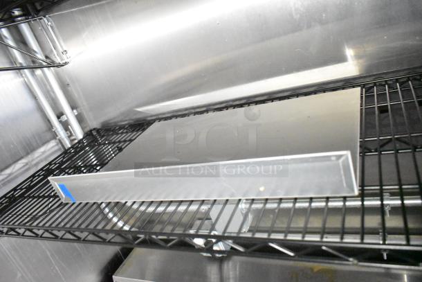 2021 Diamond Cargo 8.5' x 24' trailer interior, featuring wire shelves and stainless steel walls for cold food storage.