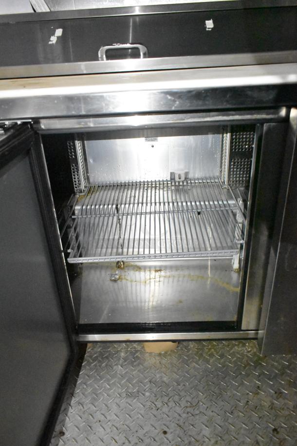 2021 Diamond Cargo 8.5' x 24' trailer, interior cold storage area with metal shelving, used condition. VIN 53NBE2429M1089847.