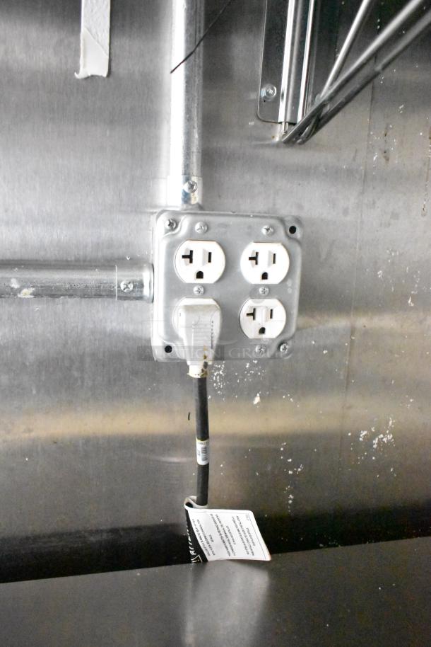 Four electric outlets in a Diamond Cargo cold food trailer, showcasing interior wiring setup, 2021 model.