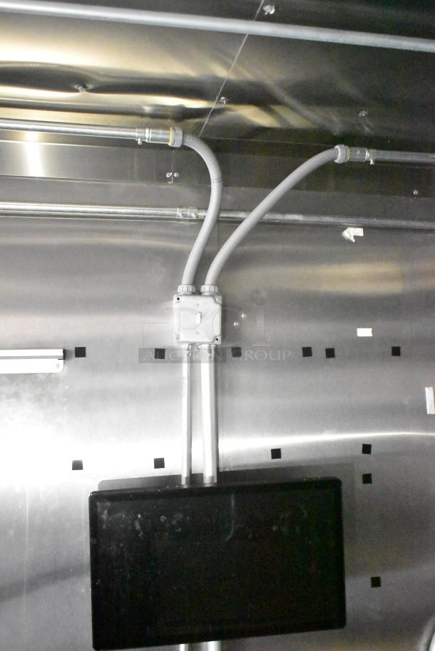 2021 Diamond Cargo cold food trailer interior showing electrical conduits and panel on a stainless steel wall. VIN 53NBE2429M1089847.