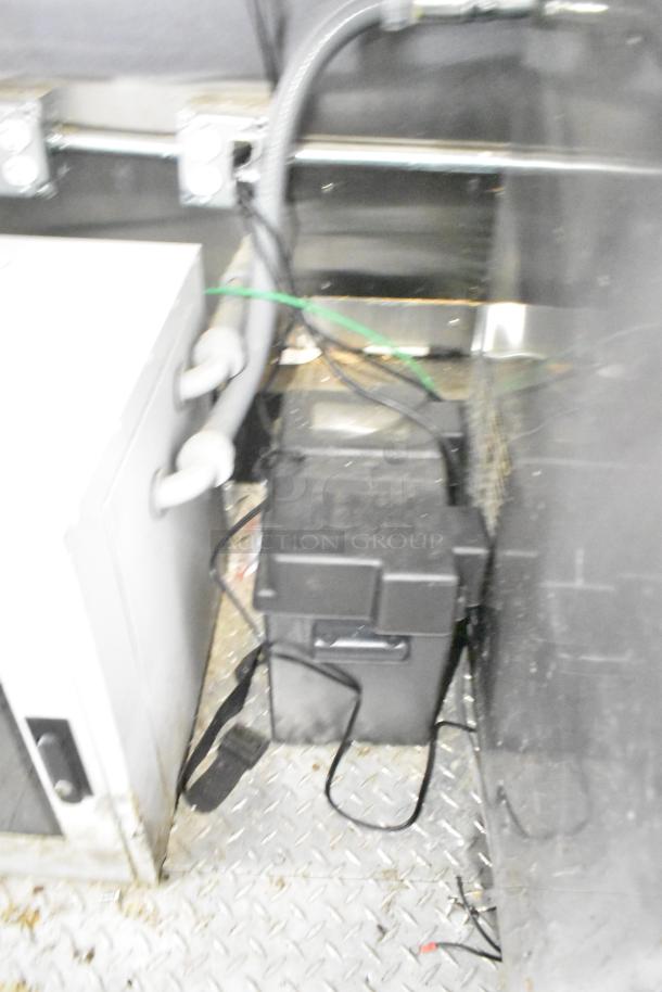 Interior view of a 2021 Diamond Cargo 8.5' x 24' trailer, showing wiring and components on a metal floor.