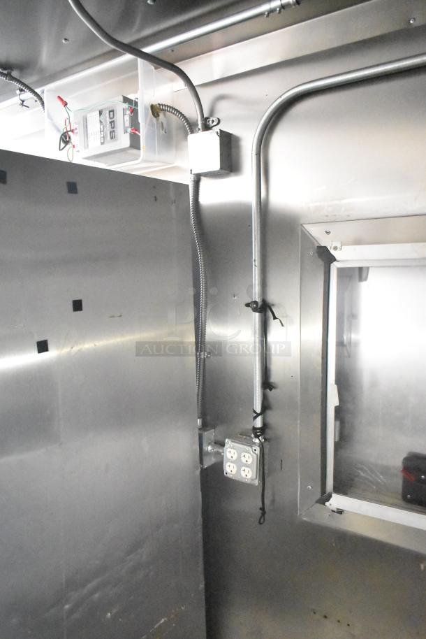 2021 Diamond Cargo 8.5' x 24' trailer interior, showing outlets and wiring. Stainless steel walls, clean condition. VIN 53NBE2429M1089847.