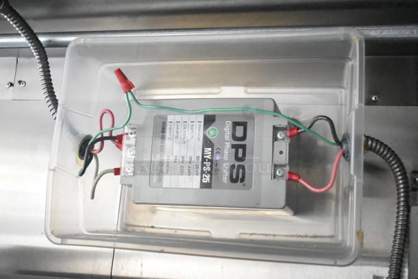 Close-up of DPS MY-PS-25 digital phase shifter inside a 2021 Diamond Cargo trailer, showing wiring and specifications label.