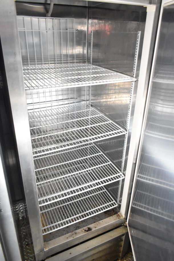 2021 Diamond Cargo 8.5' x 24' trailer interior with metal shelves, used for cold food and beverage storage.