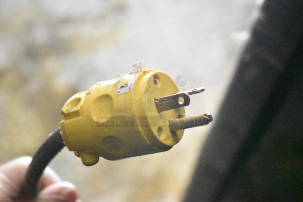 Yellow electrical plug showing wear, part of the 2021 Diamond Cargo 8.5' x 24' Cold Food & Beverage Fulfillment Trailer.
