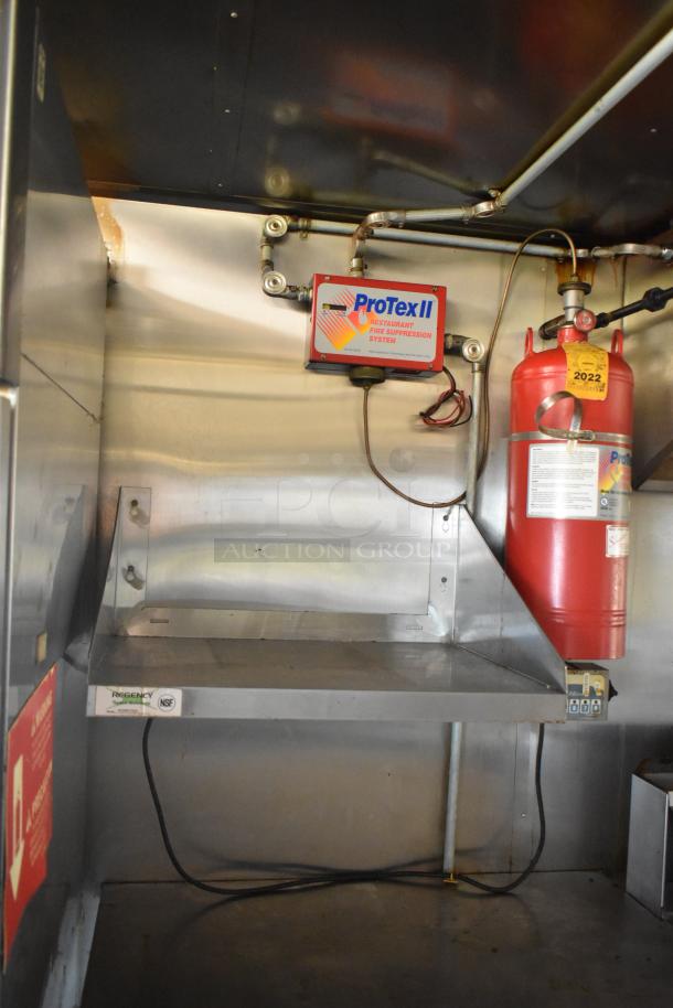 2019 Quality Cargo 24ft food trailer interior, featuring ProTex II fire suppression system and Regency shelf; restoration needed.