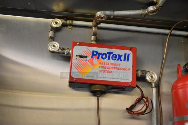 ProTex II Restaurant Fire Suppression System in 2019 Quality Cargo Food Trailer, part of cooking and refrigeration setup.
