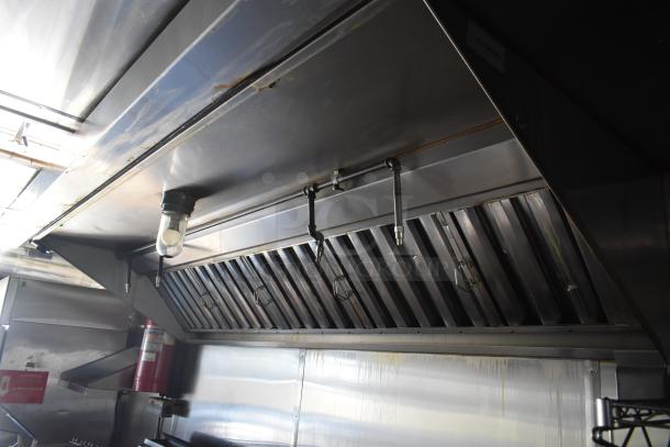 2019 Quality Cargo 24ft food trailer interior showing industrial vent hood, part of the Royal Range Gas Cooking Line.