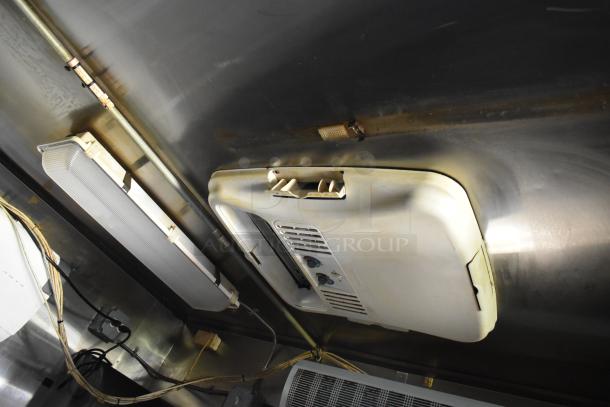 2019 Quality Cargo 24ft food trailer interior ceiling. Features vent, wiring, and lighting fixtures. Needs restoration.