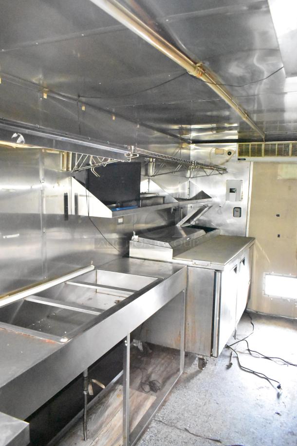 2019 Quality Cargo 24ft food trailer with grease hood, Royal Range griddle, Royal gas fryer, and four-unit refrigeration. VIN 50ZZ1E426KN012862.