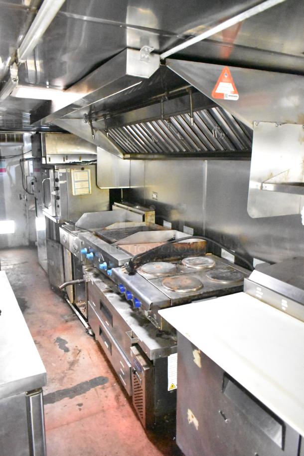 2019 Quality Cargo 24' food trailer interior with fryer, grill, pizza prep, Blodgett oven, grease hood, fire suppression.