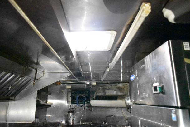 2019 Quality Cargo 24' food trailer interior, showing stainless steel hood, fryer, and Blodgett oven. Fully equipped kitchen setup.