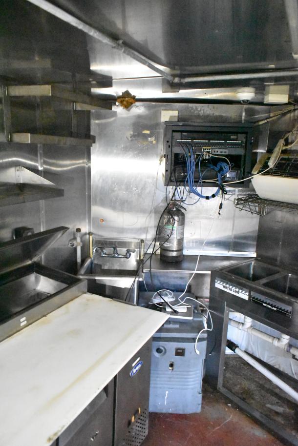 2019 Quality Cargo 24' food trailer with grease hood, fire suppression system, fryer, grill, and Blodgett oven.