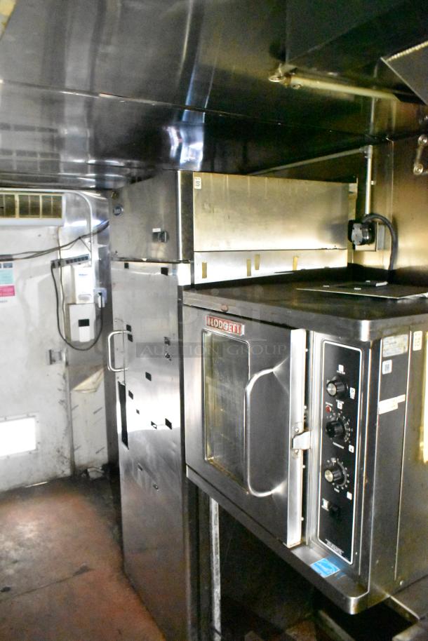 2019 Quality Cargo 24' food trailer interior with Blodgett oven, grease hood, fryer, grill, and pizza prep setup.