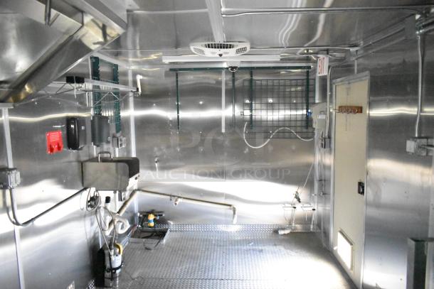 2021 Diamond Cargo 24ft x 8.5ft kitchen trailer interior, features Paragon hood, Ansul fire suppression, and steel walls.