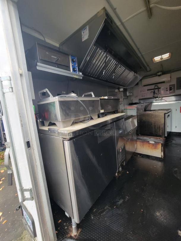 2020 Rock Solid 16' mobile trailer with high-end kitchen equipment, including fryer, exhaust hood, and refrigeration units.