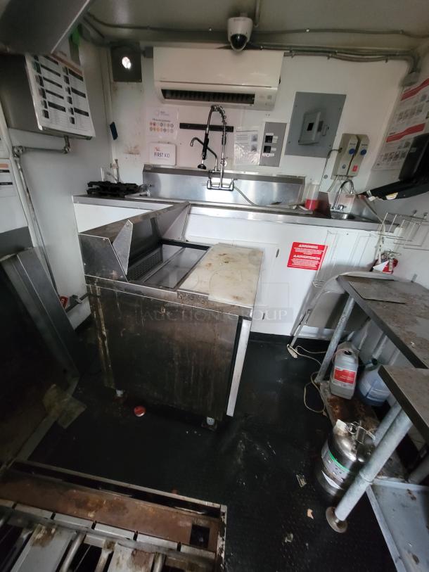 2020 Rock Solid 16' mobile trailer kitchen, fully equipped with high-end appliances, sinks, and fire suppression. Ideal for catering.