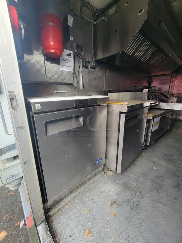 2018 16' Quality Cargo food trailer interior with professional-grade kitchen, stainless appliances, and safety systems.
