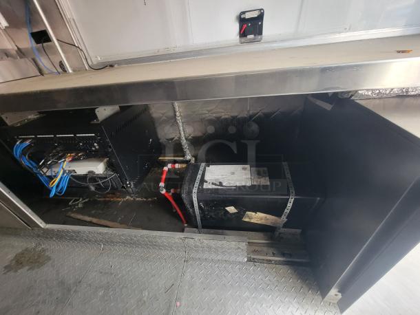 2018 Quality Cargo 16' food trailer interior wiring and utility systems. Features efficient setup for food operations.