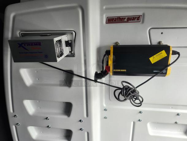 Interior of 2020 Ford Transit 350 Cargo Van showing Weather Guard partition, Xtreme heater, and 1500W inverter.