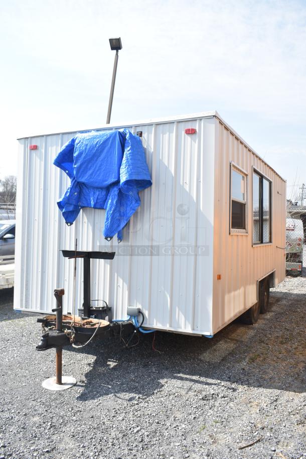 Unbranded food trailer with Diehard 27DC-2 battery, Eaton power box, counters, and ventilation fan.