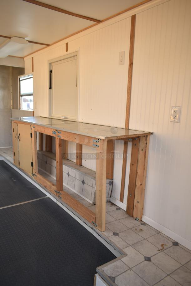 Unbranded food trailer interior with counter, Eaton power box, Diehard 27DC-2 battery slot, and ventilation fan. Good condition.