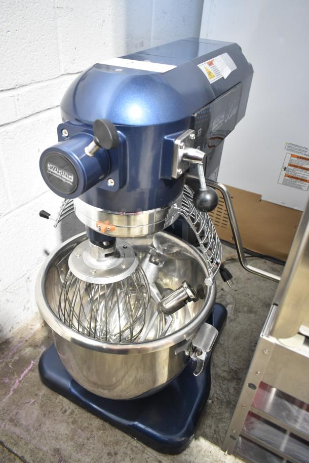 Brand new Waring WSM20LT 20-quart planetary dough mixer with bowl, guard, whisk, paddle, and dough hook attachments.