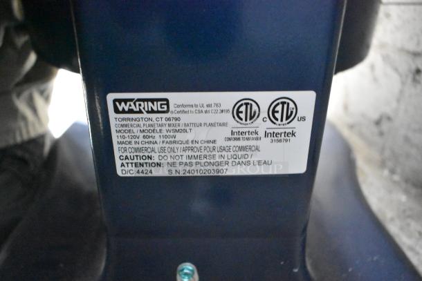 "Waring WSM20LT mixer label showing model, voltage, certifications, and usage cautions. For commercial use."