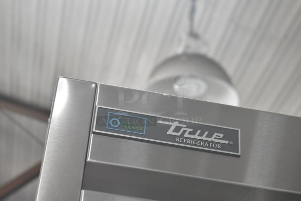 2020 True T-49-HC commercial cooler, stainless steel, 2 doors, on casters, 115V, 1 phase. Natural refrigerant label visible.