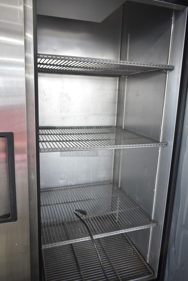 2020 True T-49-HC cooler, commercial, 2-door, metal shelving, on casters, 115V, 1 phase, good condition.