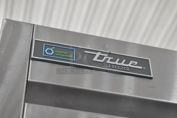 2020 True T-49F-HC commercial cooler with natural refrigerant label, stainless steel finish, visible brand logo.
