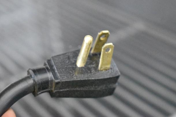 Close-up of a three-prong plug for the 2020 True T-49F-HC commercial cooler. 115 volts, 1 phase.