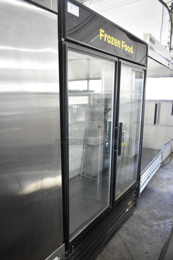 True GDM-49F-LD Commercial 2 Door Reach In Freezer Merchandiser, 115/208-230 Volts, 1 Phase, clear glass doors, "Frozen Food" label.