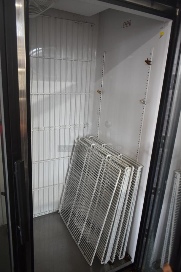 True GDM-49F-LD 2 Door Reach In Freezer Merchandiser interior with shelves; 115/208-230V, 1 Phase.