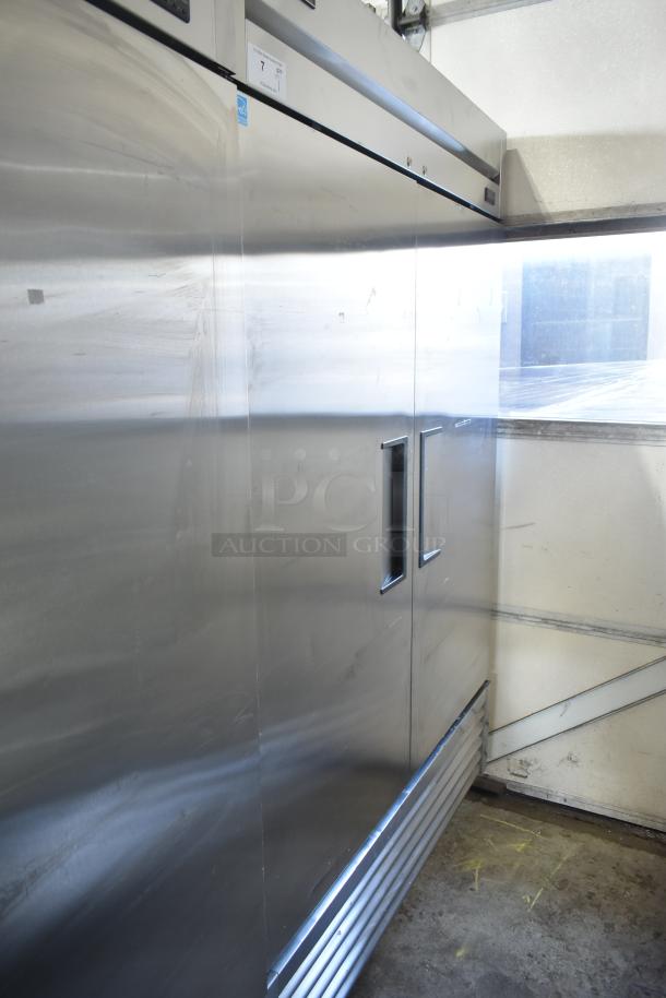 2019 True T-49-HC commercial 2-door reach-in cooler, stainless steel, on casters. Visible wear, uses 115 volts, 1 phase.