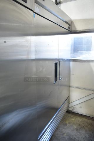 2019 True T-49-HC commercial 2-door reach-in cooler, stainless steel, on casters. Visible wear, uses 115 volts, 1 phase.