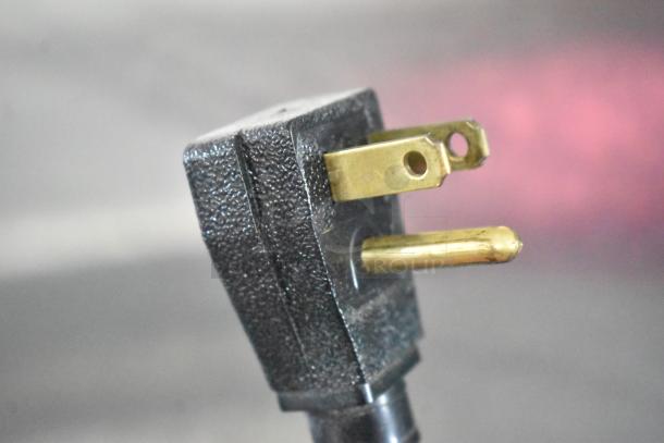 Close-up of a three-prong power plug for the 2019 True T-49-HC Commercial 2 Door Reach In Cooler.