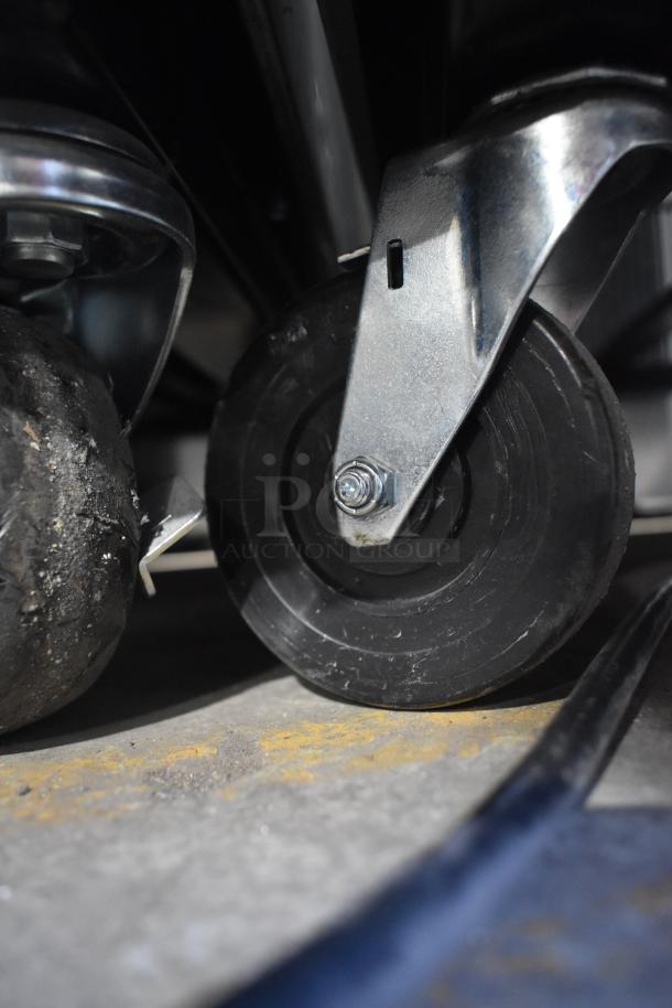 2019 True T-49-HC Commercial Cooler on sturdy casters; close-up of caster wheel, showing durability and mobility.