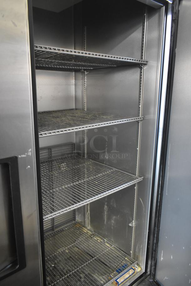 2019 True T-49-HC 2 Door Reach-In Cooler, stainless steel, commercial casters, 115V, 1 phase, multiple shelves.