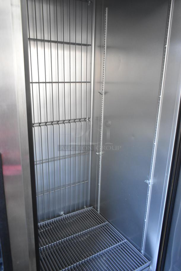 2020 True T-49F-HC commercial reach-in freezer, two doors, stainless steel interior, on casters, excellent condition.