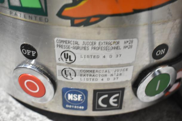Santos Commercial Countertop Juice Extractor, model No. 28, featuring UL and NSF certifications, with on/off buttons visible.