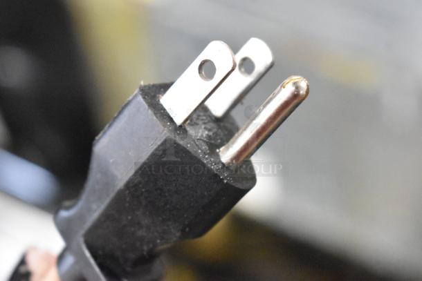 Close-up of a three-prong plug for a Bunn ICB-DV automatic coffee brewer, indicates 120 volts, 1 phase.
