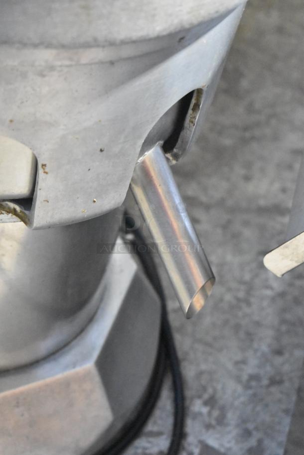 Ruby 2000 Commercial Juice Extractor, 115V, 1 Phase, visible spout, stainless steel, used condition.